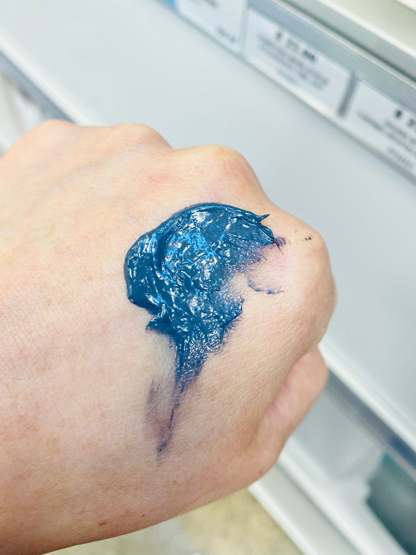 Image of DDP Purifying Charcoal and BHA Scrub 75 ml Limited Edition being shown on the hand
