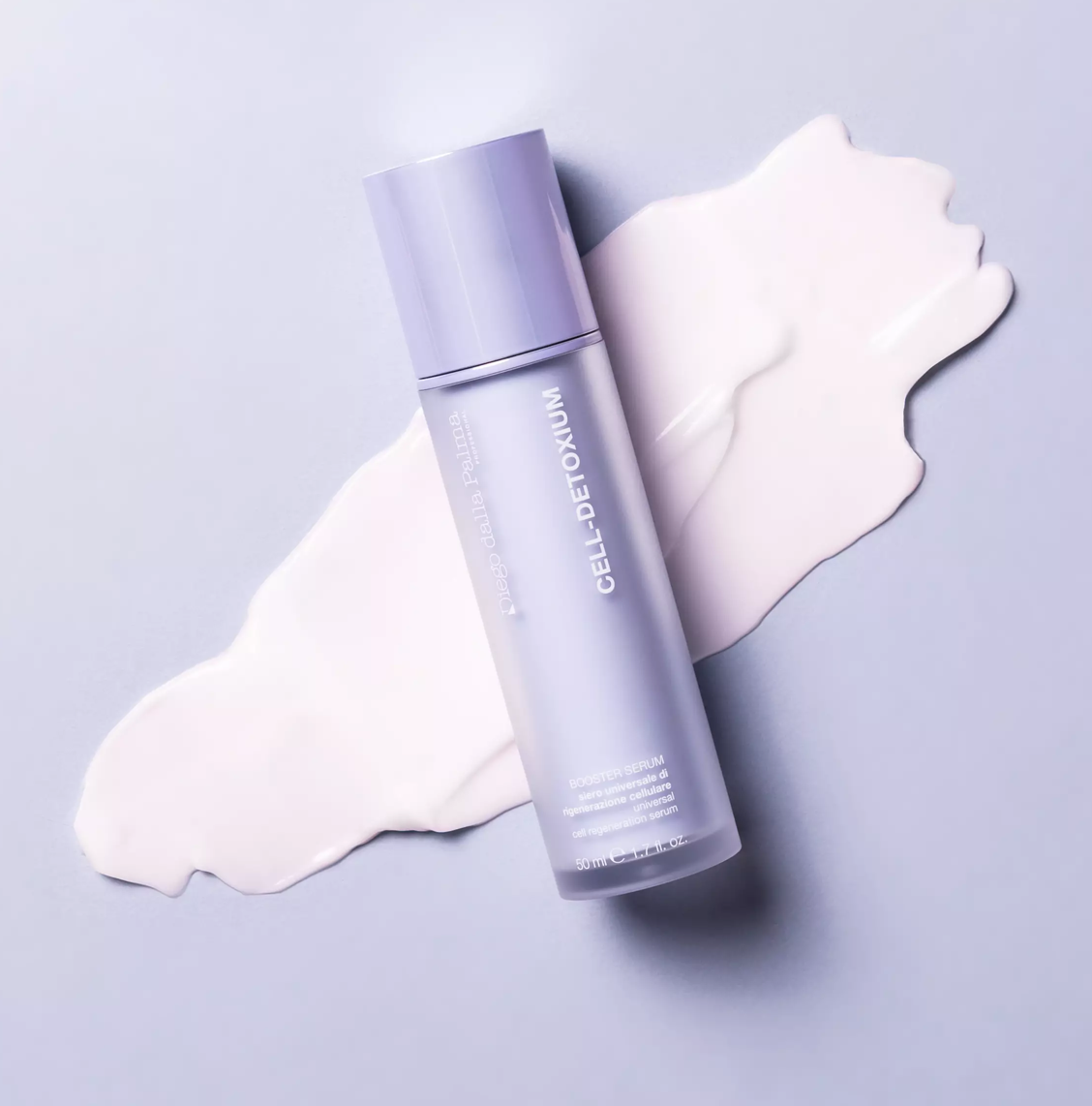 Skincare bottle labeled 'Cell Detoxium' on a light gray background with a white cream smear.