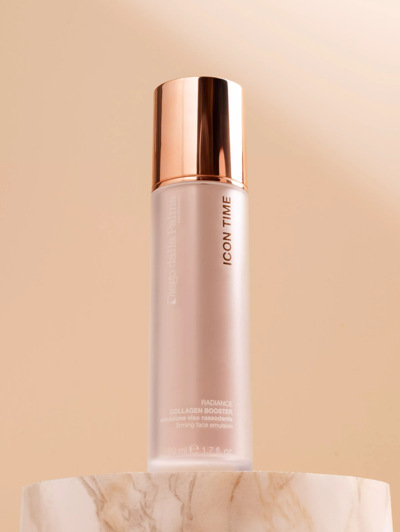 Skincare bottle with rose gold cap on a beige background